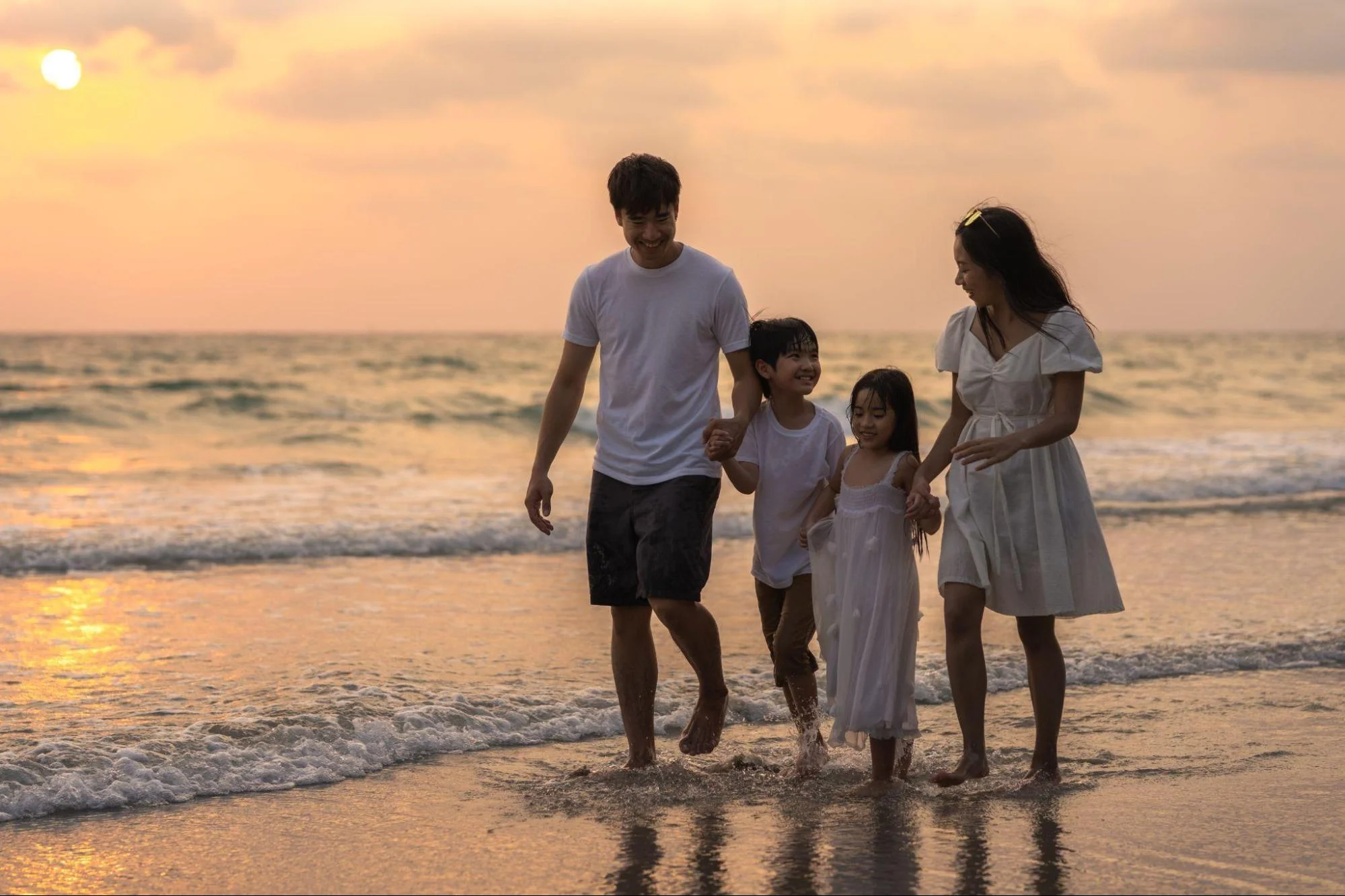 a happy family enjoying at the beach