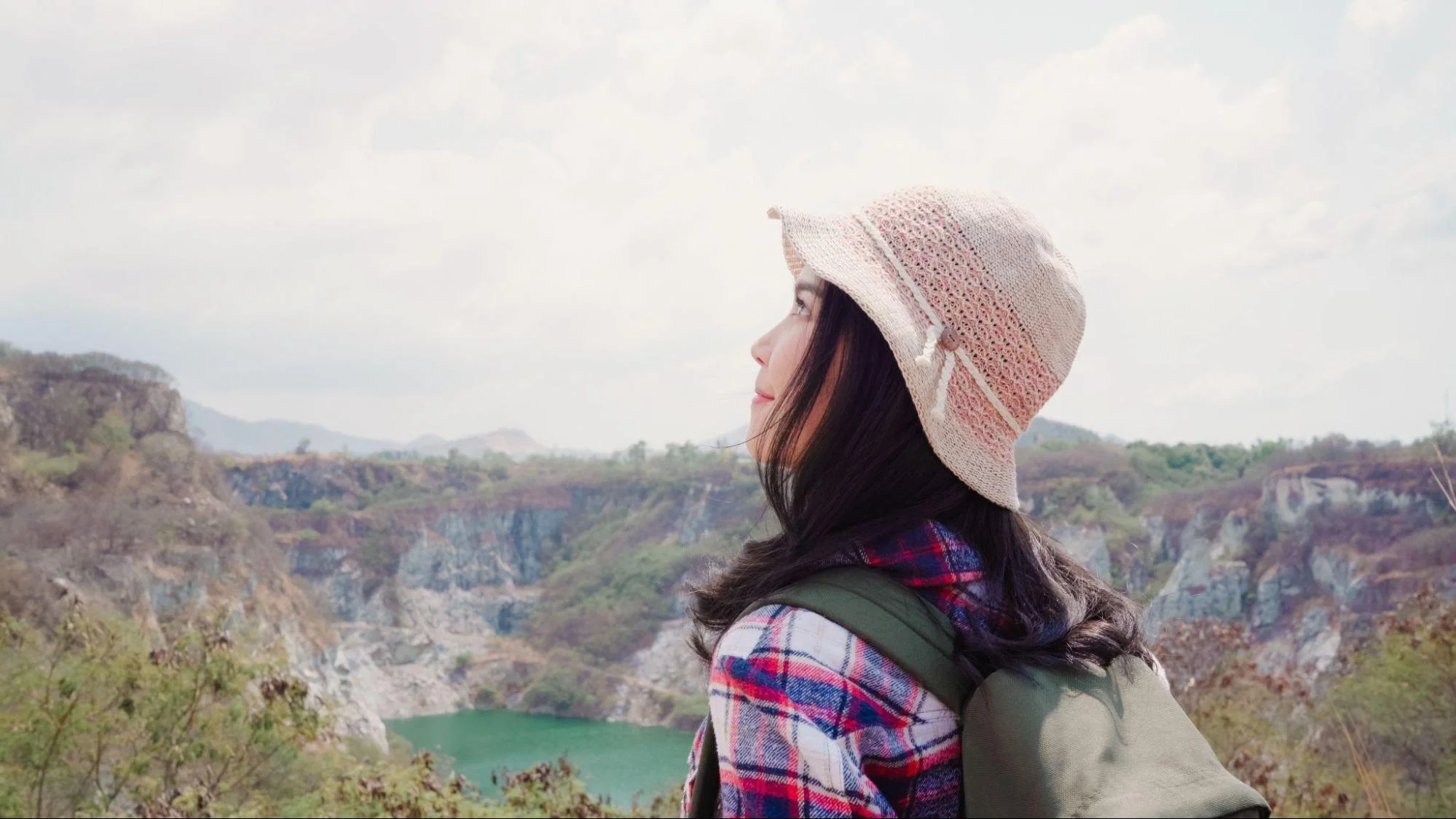 Female backpacker at the top of a mountain